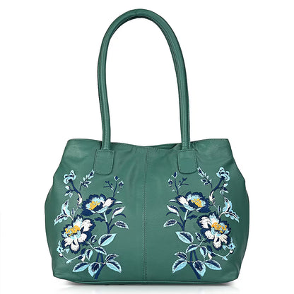Turquoise leather tote bag with floral pattern