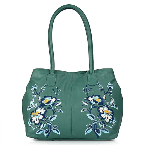 Turquoise leather tote bag with floral pattern