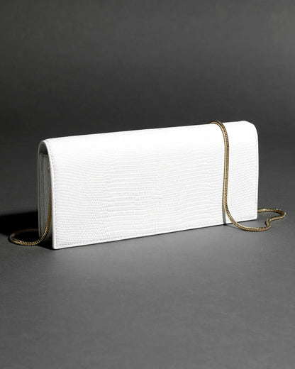 White twisted-detail gold-tone hardware bag with side handle, chain strap, and dual-carry functionality (handheld/shoulder)