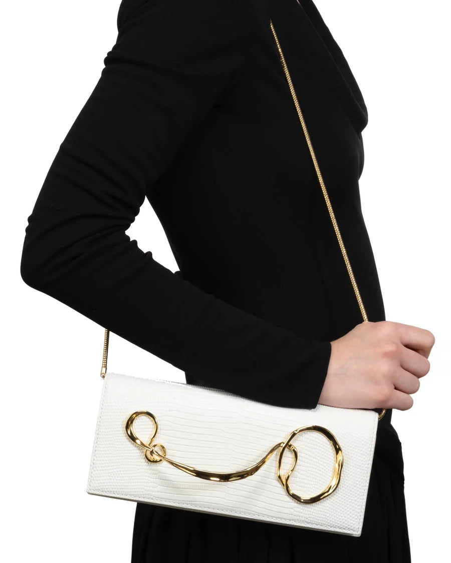 White twisted-detail gold-tone hardware bag with side handle, chain strap, and dual-carry functionality (handheld/shoulder)
